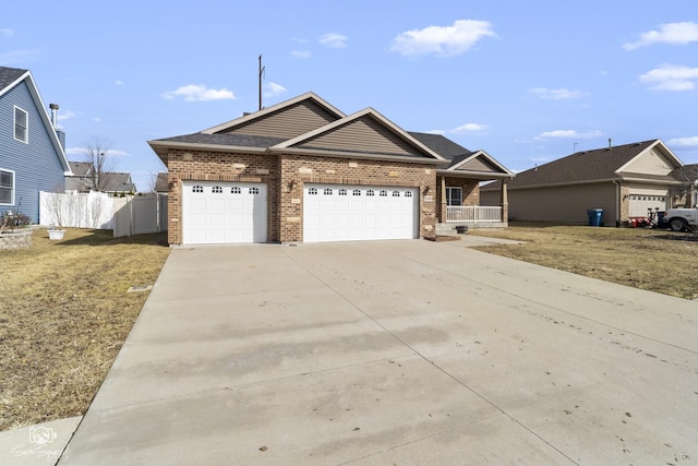 view of front facade with brick siding, fence, a porch, concrete driveway, and a garage