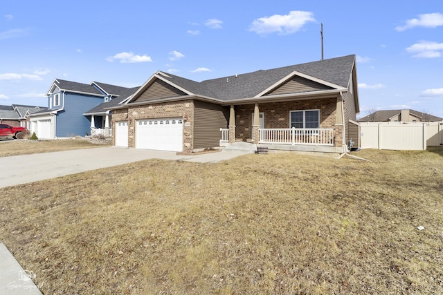 single story home featuring concrete driveway, fence, brick siding, and covered porch