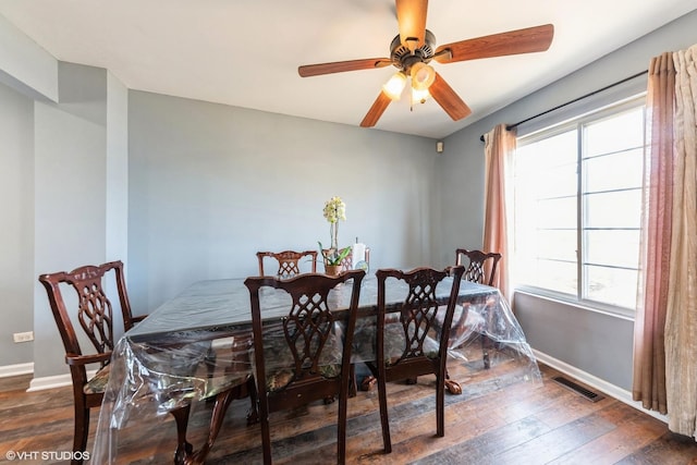 dining area with a ceiling fan, hardwood / wood-style flooring, baseboards, and visible vents