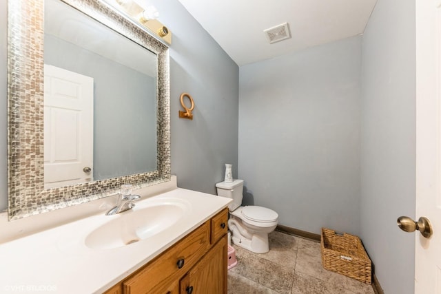 bathroom with visible vents, baseboards, toilet, and vanity