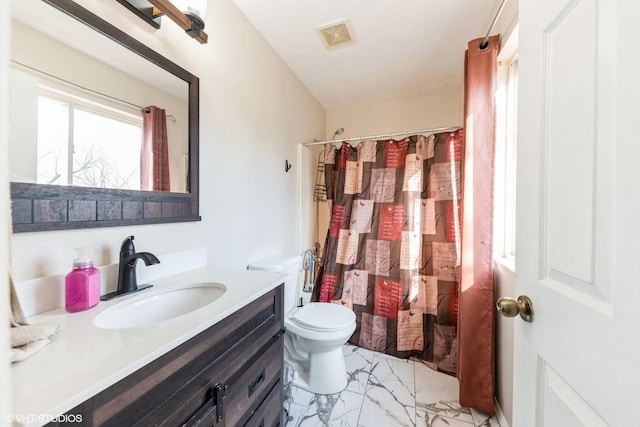 full bathroom featuring marble finish floor, curtained shower, vanity, and toilet