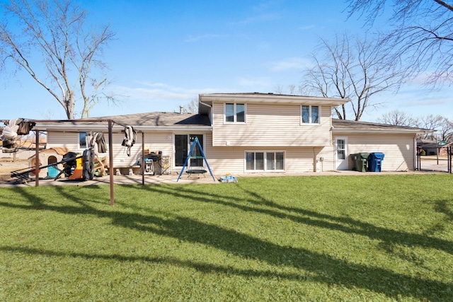 rear view of property with a patio area and a lawn