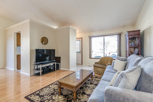 living room with light wood-style flooring and baseboards