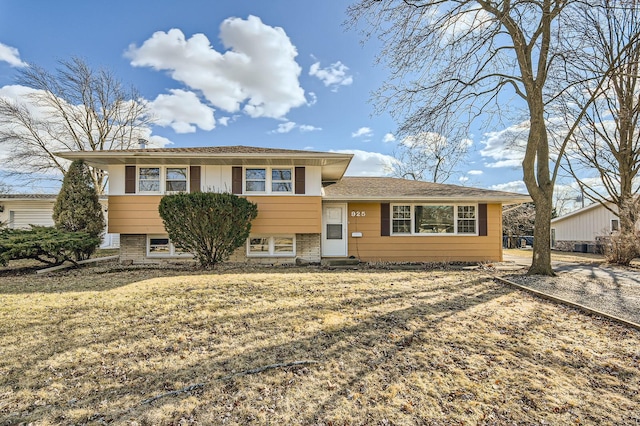 tri-level home with brick siding