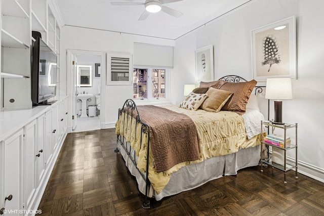 bedroom featuring ensuite bath and ceiling fan