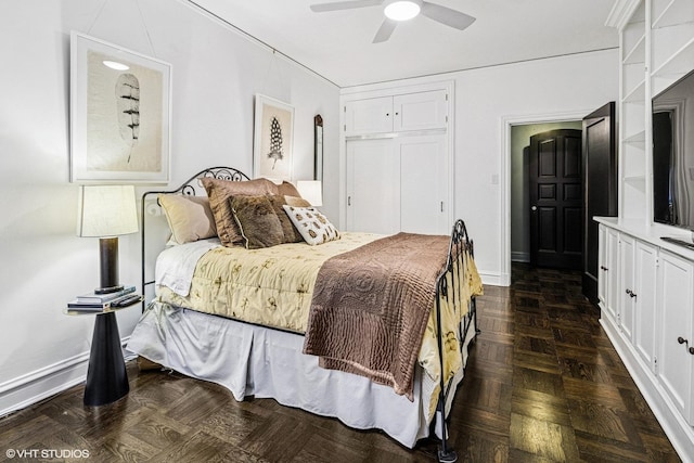 bedroom with a ceiling fan, baseboards, and a closet