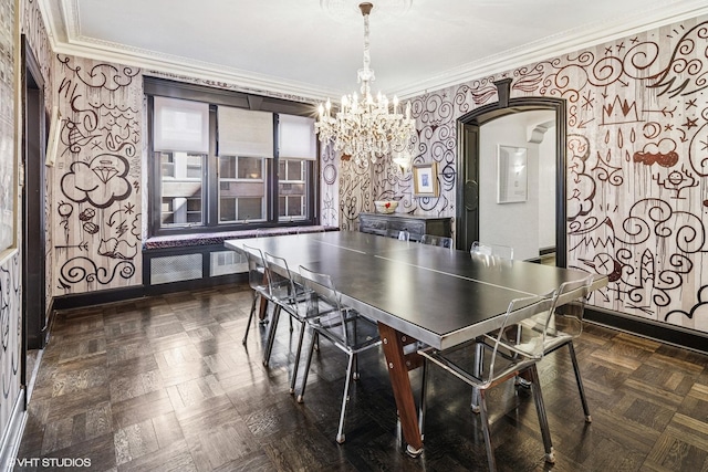 recreation room with wallpapered walls, crown molding, baseboards, an inviting chandelier, and arched walkways