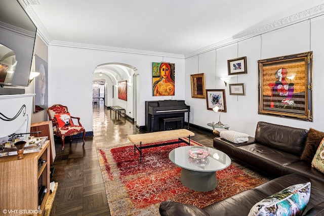 living room featuring arched walkways, crown molding, and baseboards