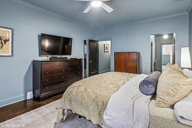 bedroom with a ceiling fan, crown molding, and baseboards