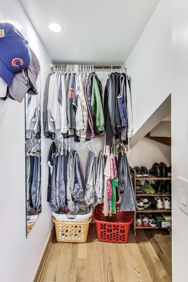 spacious closet with wood finished floors