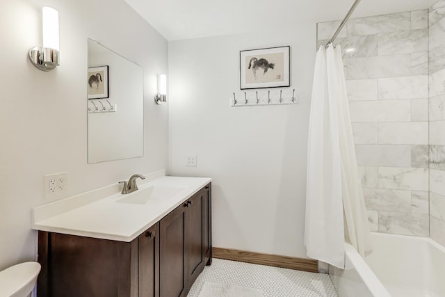 full bathroom with vanity, shower / bath combo with shower curtain, and baseboards