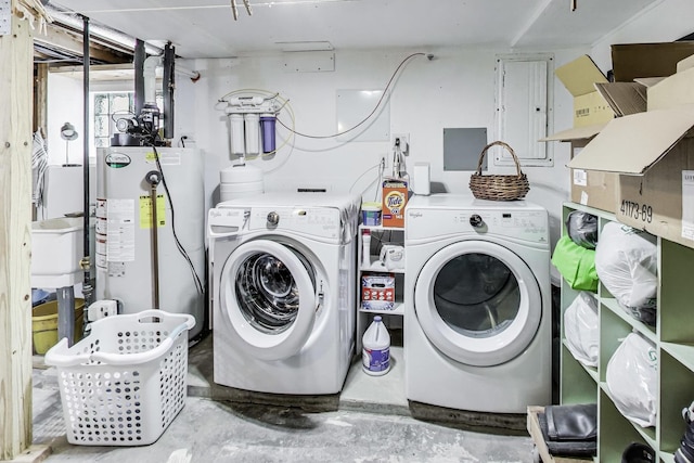 laundry area with water heater, laundry area, independent washer and dryer, and electric panel