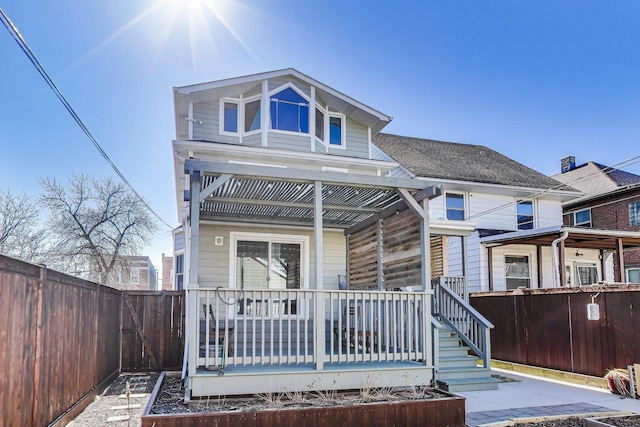 view of front of home with a fenced backyard