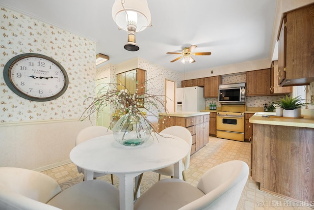 1408 N W St, Naperville, IL 60563 - kitchen featuring wallpapered walls, light floors, baseboards, white appliances, and light countertops