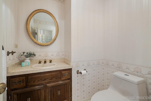 1408 N W St, Naperville, IL 60563 - bathroom featuring vanity, toilet, and wallpapered walls
