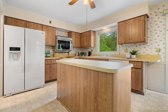 1408 N W St, Naperville, IL 60563 - kitchen featuring white fridge with ice dispenser, a sink, light floors, stainless steel microwave, and light countertops