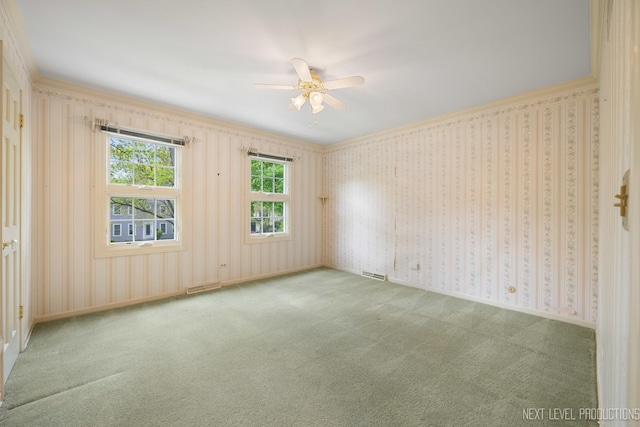 1408 N W St, Naperville, IL 60563 - empty room with ornamental molding, visible vents, ceiling fan, and carpet floors