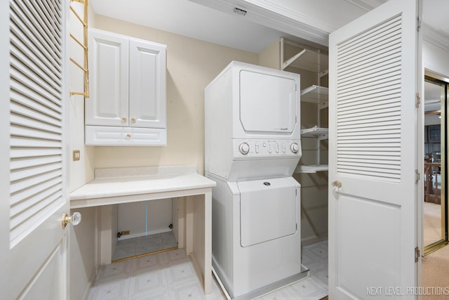 1408 N W St, Naperville, IL 60563 - laundry area with laundry area, light floors, baseboards, and stacked washer and dryer
