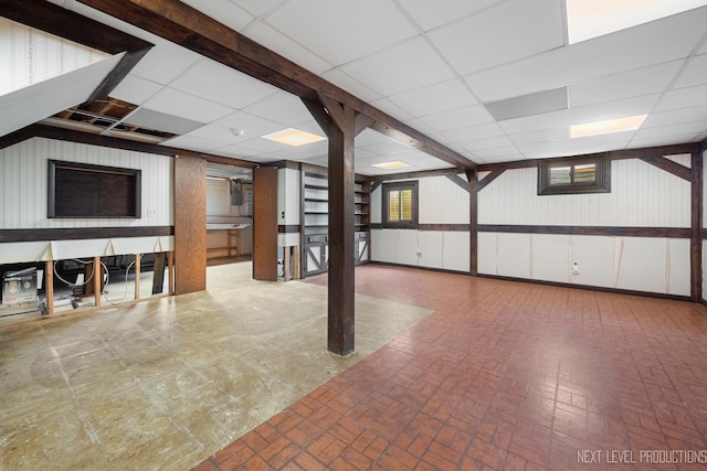 1408 N W St, Naperville, IL 60563 - basement featuring a drop ceiling, brick patterned floor, and a wealth of natural light