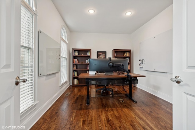 office area with recessed lighting, visible vents, baseboards, and wood finished floors