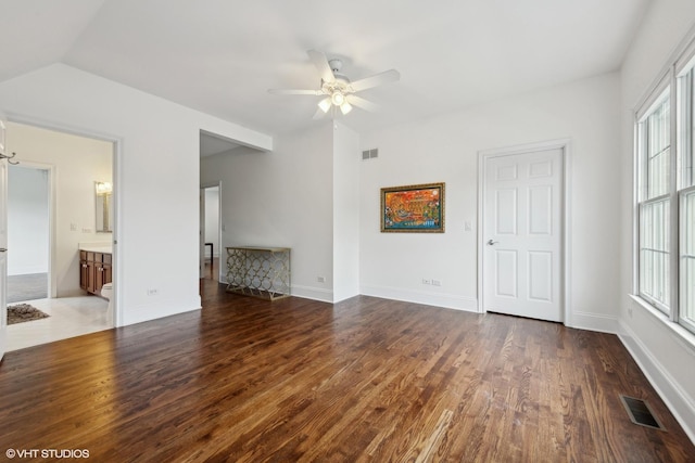 interior space featuring visible vents, baseboards, and wood finished floors