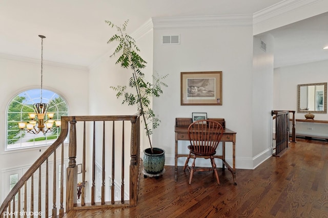 hall featuring visible vents, an upstairs landing, a notable chandelier, wood finished floors, and crown molding