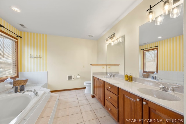 bathroom featuring wallpapered walls, tile patterned flooring, and a sink