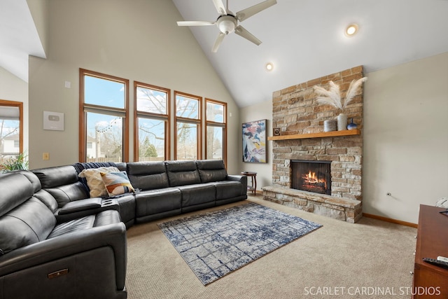 carpeted living room featuring a ceiling fan, baseboards, high vaulted ceiling, and a fireplace