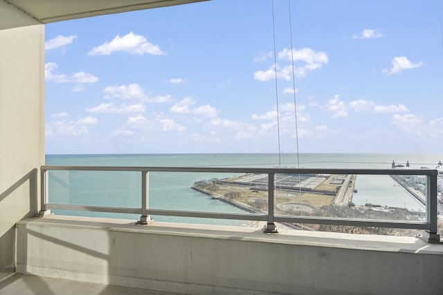 balcony featuring a water view