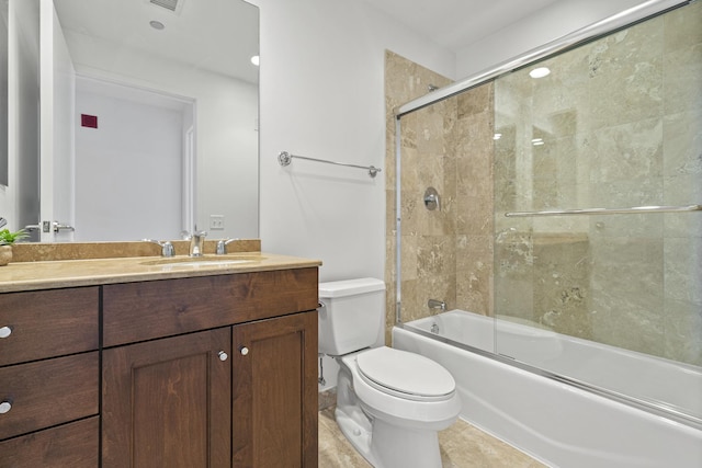 bathroom featuring visible vents, toilet, tile patterned floors, combined bath / shower with glass door, and vanity