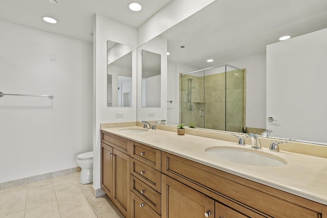 bathroom with tile patterned flooring, a stall shower, toilet, and a sink