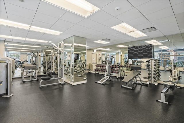 workout area featuring a paneled ceiling