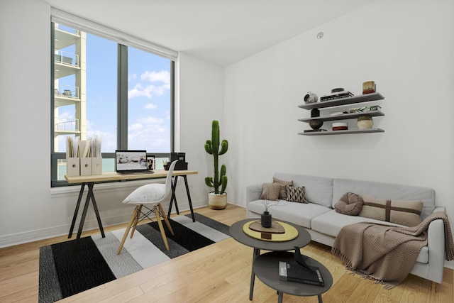 interior space featuring baseboards and wood finished floors