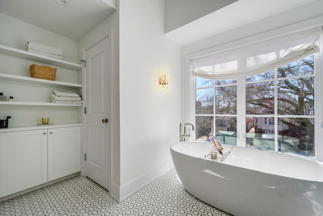 2852 W Mclean Ave, Chicago, IL 60647 - full bathroom with a freestanding bath and baseboards