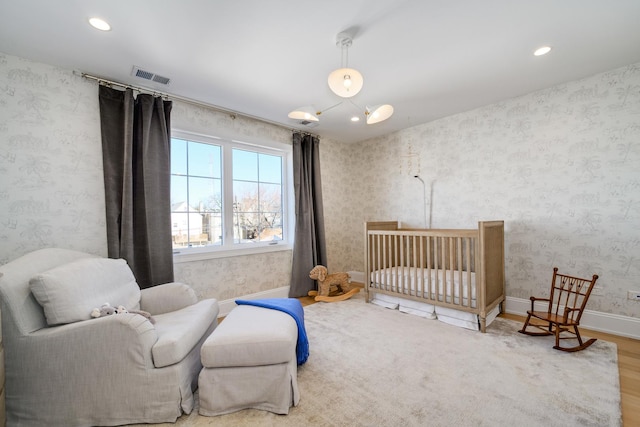 bedroom featuring visible vents, wallpapered walls, baseboards, recessed lighting, and wood finished floors