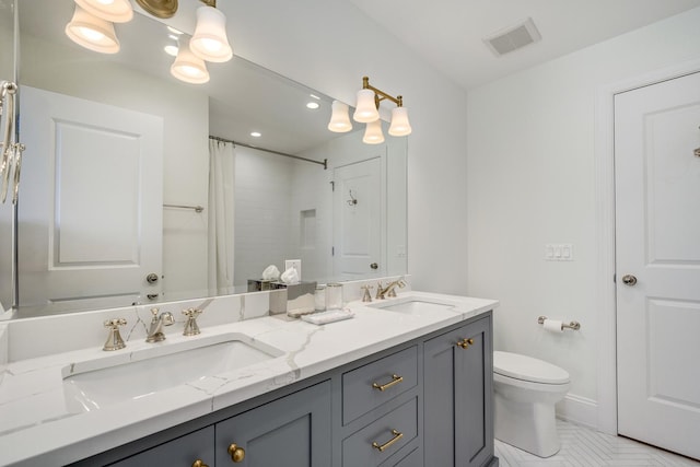 full bath with double vanity, toilet, visible vents, and a sink