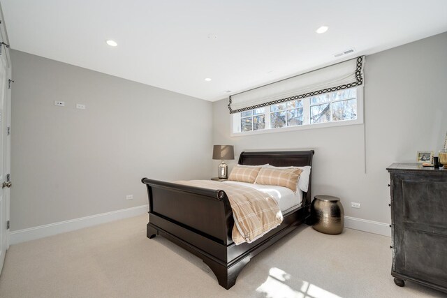 bedroom featuring light carpet, visible vents, recessed lighting, and baseboards