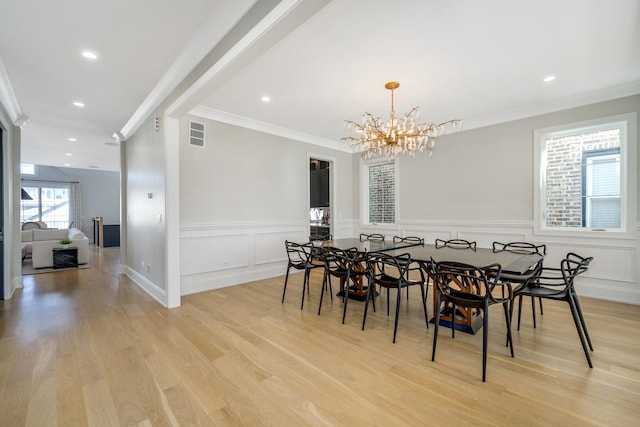 dining space featuring crown molding, recessed lighting, visible vents, and light wood finished floors