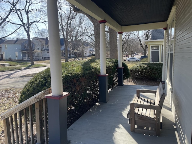 view of patio / terrace with a residential view and covered porch