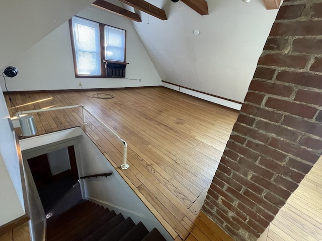 bonus room with stairway, cooling unit, lofted ceiling with beams, and wood-type flooring