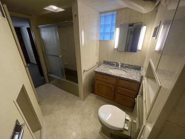 full bath featuring vanity, a shower stall, and toilet