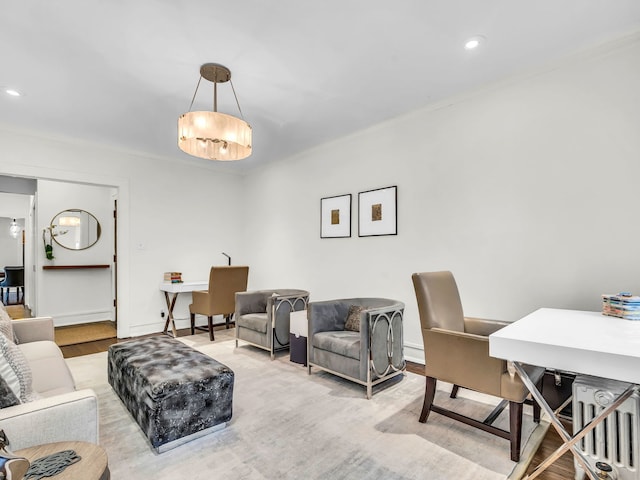 living area with recessed lighting, baseboards, and wood finished floors