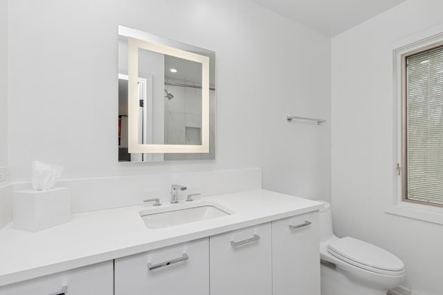 full bathroom featuring toilet and vanity