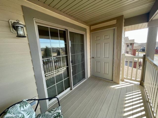 doorway to property featuring a balcony