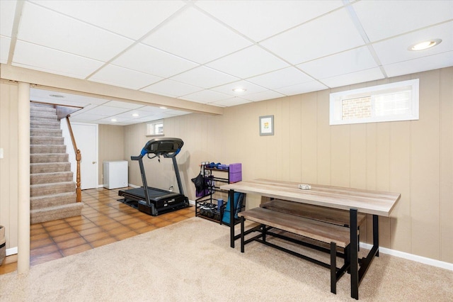 exercise room with a drop ceiling, recessed lighting, and carpet floors