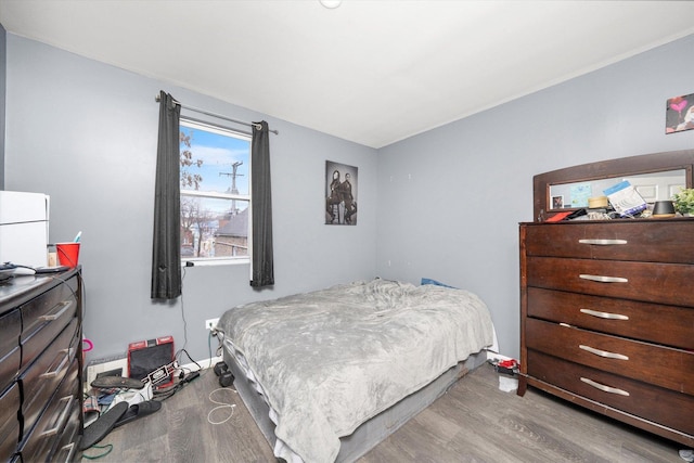 bedroom with wood finished floors