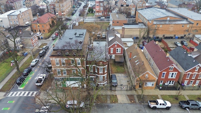 birds eye view of property with a residential view