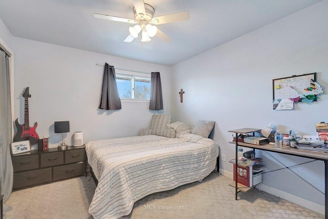 bedroom with baseboards, a ceiling fan, and carpet floors