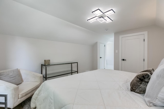 bedroom featuring lofted ceiling