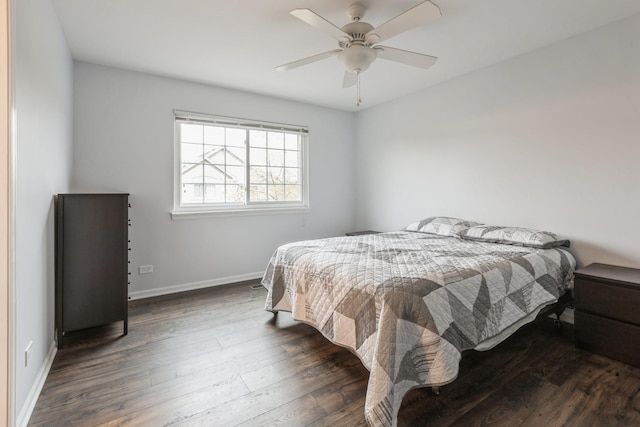 bedroom featuring baseboards, dark wood-type flooring, and ceiling fan